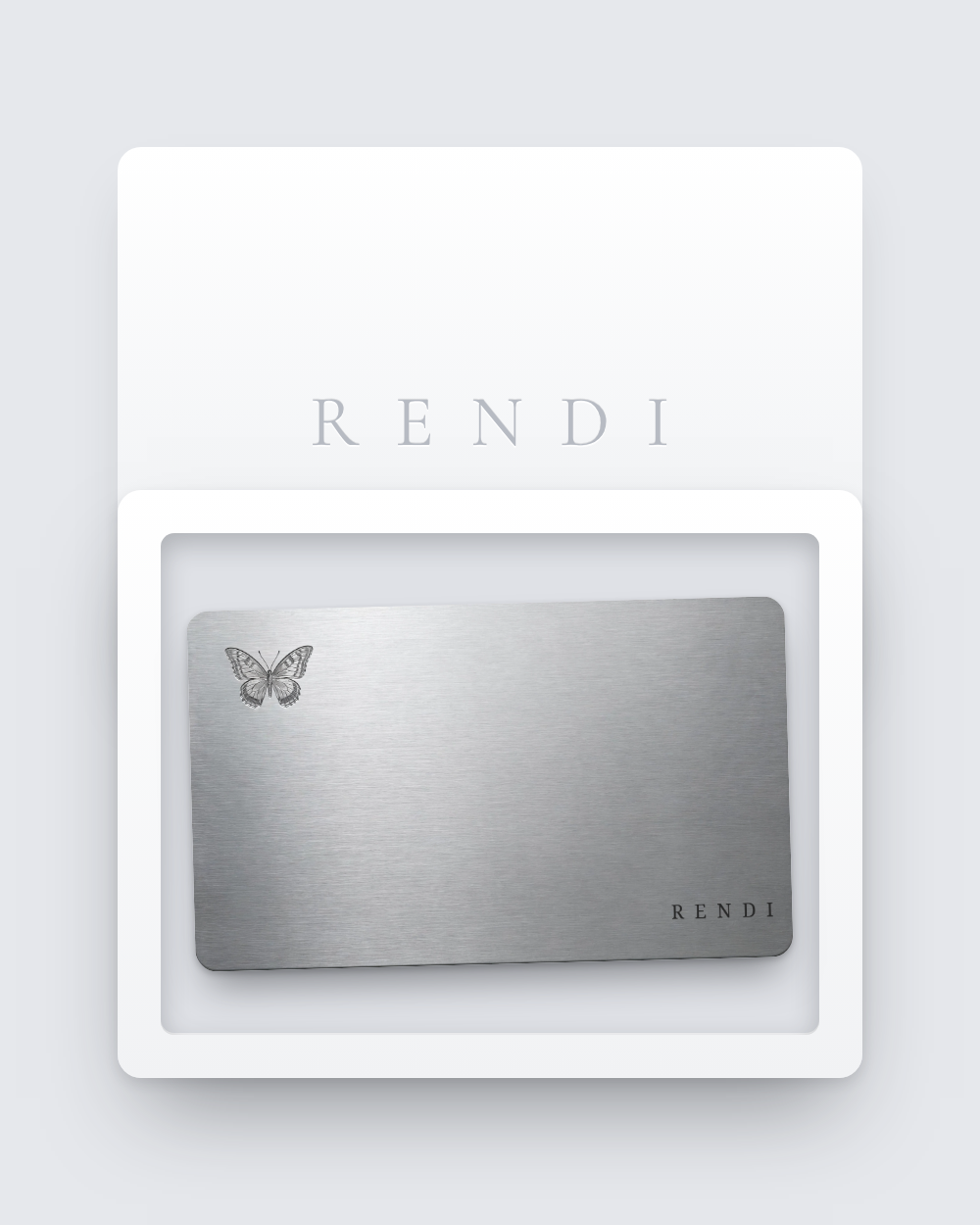 The brushed-metal Collector Card resting in a white keepsake box with the Rendi lid beside it.